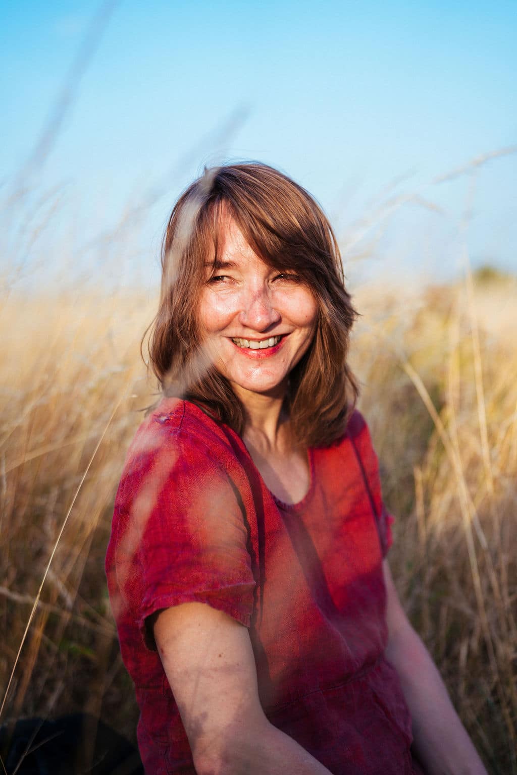 CA102177 A photo of Emily Woof smiling, wearing a green shirt